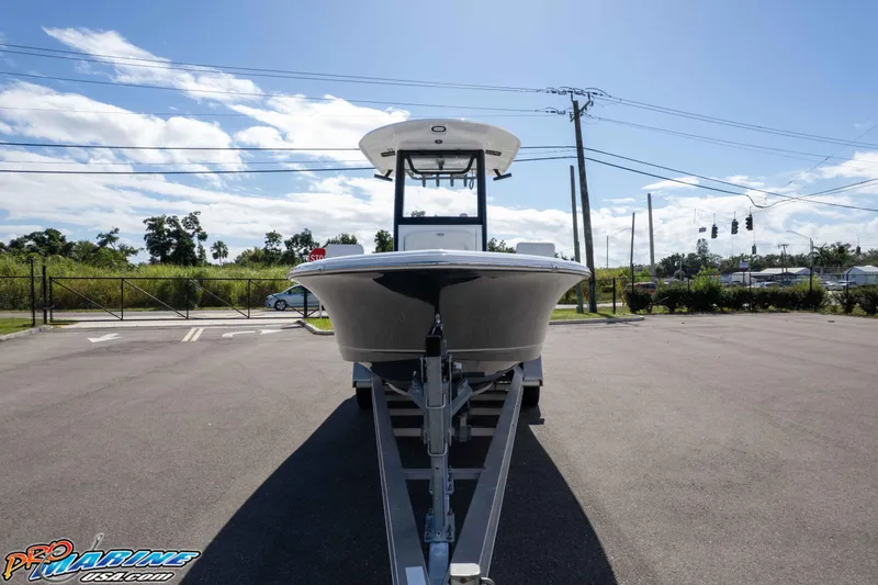 Slide: The Image of 2026 Sea Hunt BX 25 FS boat on trailer in parking lot under clear sky. - 28