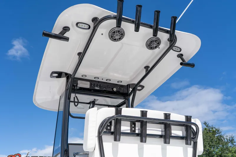 Slide: The Image of 2026 Sea Hunt BX 25 FS boat top view with rod holders and speakers against blue sky. - 29