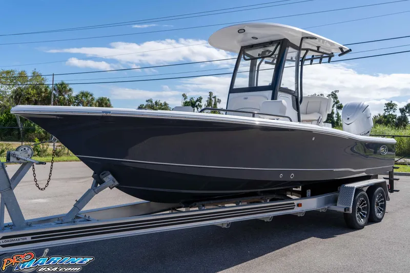 Slide: The Image of 2026 Sea Hunt BX 25 FS boat on trailer, sleek design, ready for adventure. - 3