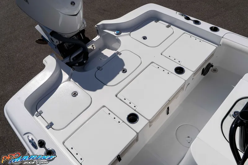 Slide: The Image of 2026 Sea Hunt BX 25 FS boat deck with storage compartments and motor. - 35