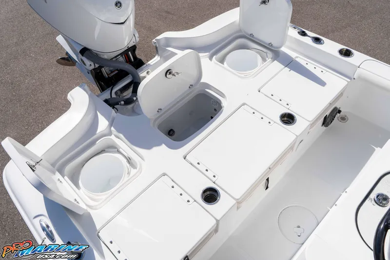 Slide: The Image of 2026 Sea Hunt BX 25 FS boat deck with storage compartments and Yamaha engine. - 37