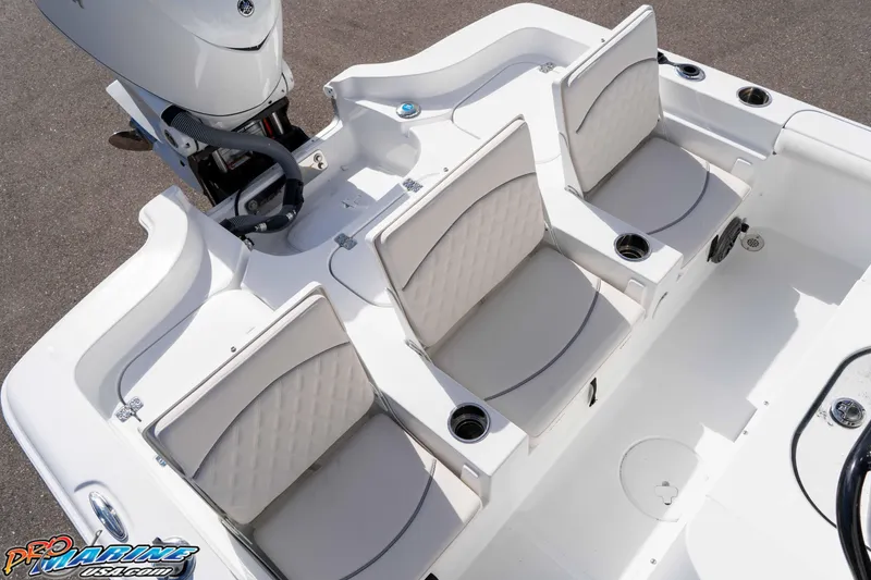 Slide: The Image of 2026 Sea Hunt BX 25 FS boat with three cushioned seats and cup holders. - 38