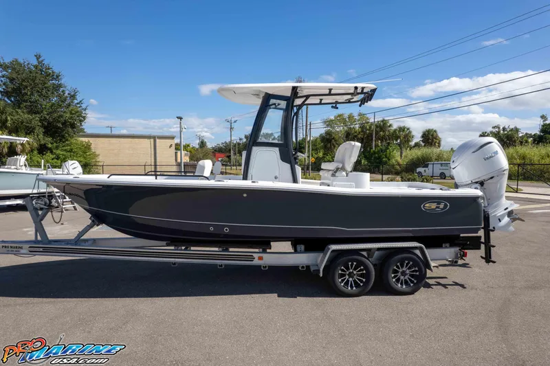 Slide: The Image of 2026 Sea Hunt BX 25 FS boat on trailer, side view, outdoors, clear sky. - 4