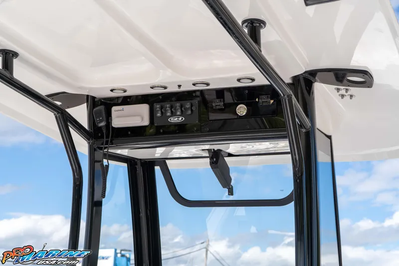 Slide: The Image of 2026 Sea Hunt BX 25 FS boat console with Garmin electronics and overhead storage. - 40
