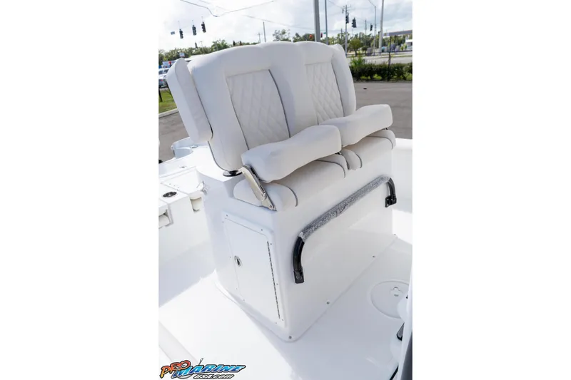 Slide: The Image of 2026 Sea Hunt BX 25 FS boat with cushioned seating and storage compartment. - 41