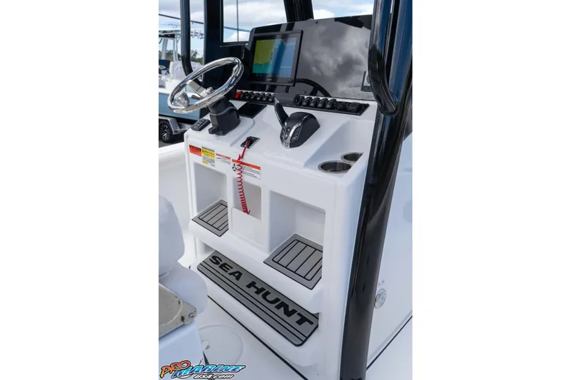 Slide: The Image of 2026 Sea Hunt BX 25 FS boat console with steering wheel and navigation display. - 45