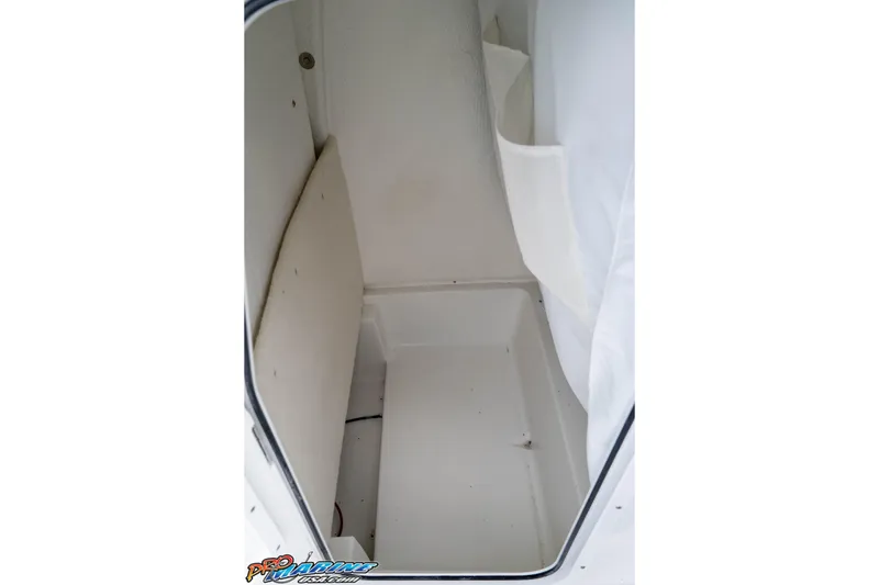 Slide: The Image of Interior view of 2026 Sea Hunt BX 25 FS boat storage compartment. - 50