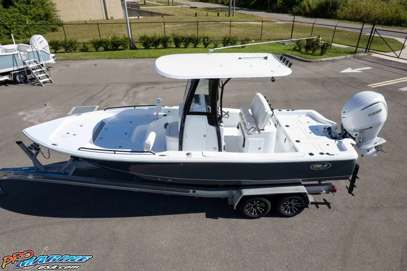 Slide: The Image of 2026 Sea Hunt BX 25 FS boat on trailer, featuring Yamaha outboard motor. - 6