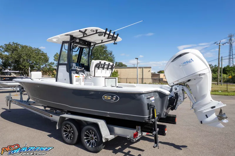 Slide: The Image of 2026 Sea Hunt BX 25 FS boat on trailer, featuring Yamaha outboard motor. - 8