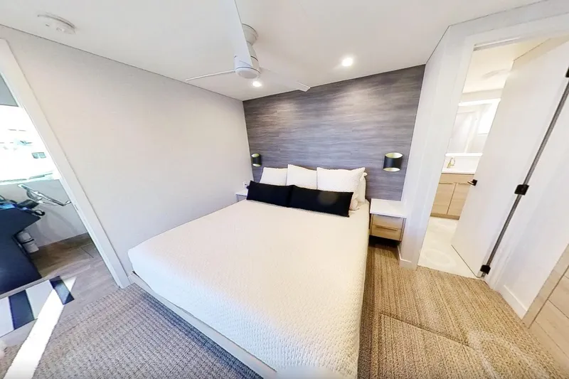 Slide: The Image of Modern bedroom in 2022 Adonia Splendor yacht, featuring cozy bed and stylish decor. - 17