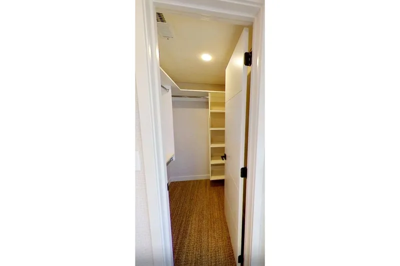 Slide: The Image of Walk-in closet with shelves and hanging space in Adonia Splendor 2022 model. - 30