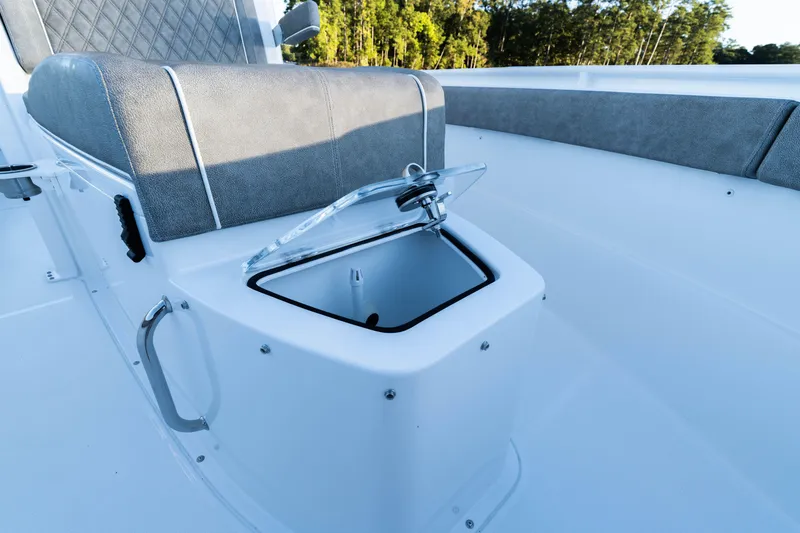 Slide: The Image of 2026 Sea Hunt Ultra 275 Coffin Box with open storage compartment and cushioned seating. - 38