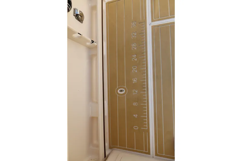 Slide: The Image of Grady-White Freedom 275 boat deck with integrated ruler, 2025 model. - 7