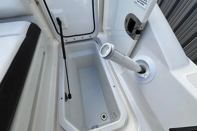 Slide: The Image of 2018 Sea Ray SDX 270 Outboard storage compartment with open hatch and hydraulic support. - 10