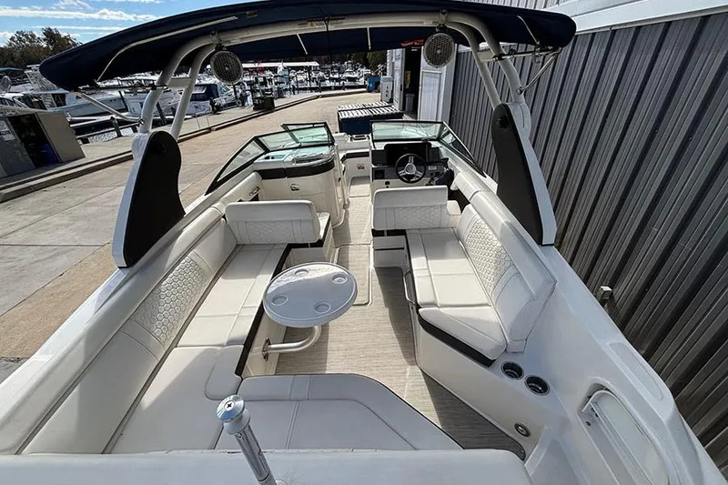 Slide: The Image of 2018 Sea Ray SDX 270 Outboard boat interior with spacious seating and modern design. - 11