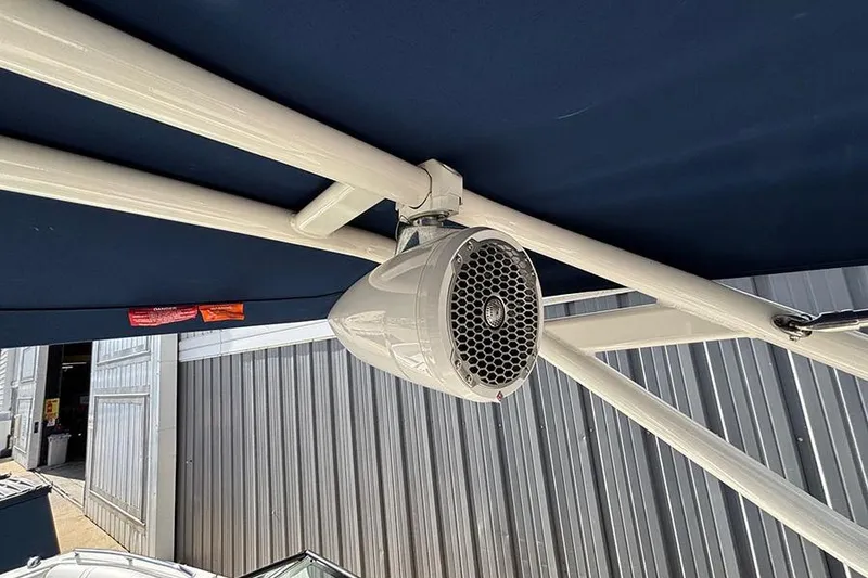 Slide: The Image of 2018 Sea Ray SDX 270 Outboard boat speaker under blue canopy. - 25