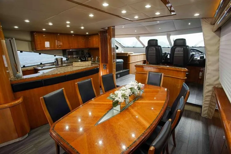 Slide: The Image of Luxurious interior of 2006 Sunseeker Manhattan Motor 82 yacht with elegant dining area and helm. - 13