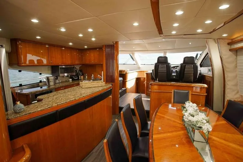 Slide: The Image of Luxurious interior of 2006 Sunseeker Manhattan Motor 82 yacht with elegant dining and helm area. - 14