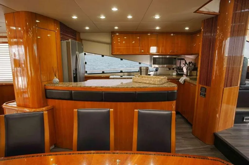Slide: The Image of Luxurious kitchen interior of 2006 Sunseeker Manhattan Motor 82 yacht with wood finish. - 16