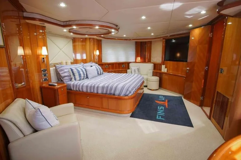 Slide: The Image of Luxurious bedroom interior of 2006 Sunseeker Manhattan Motor 82 yacht, featuring elegant wood finishes. - 19