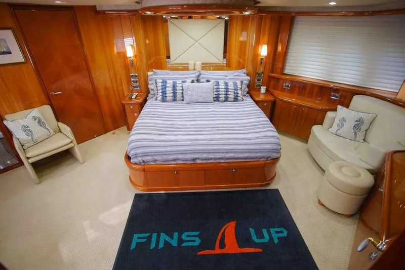Slide: The Image of Luxurious bedroom in 2006 Sunseeker Manhattan Motor 82 yacht with elegant wood finishes. - 20