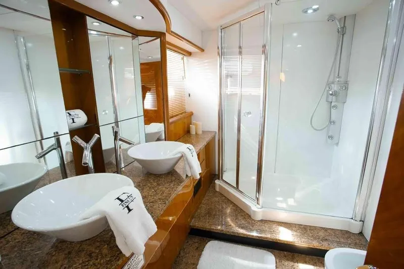 Slide: The Image of Luxurious bathroom in 2006 Sunseeker Manhattan Motor 82 yacht with modern fixtures and shower. - 23