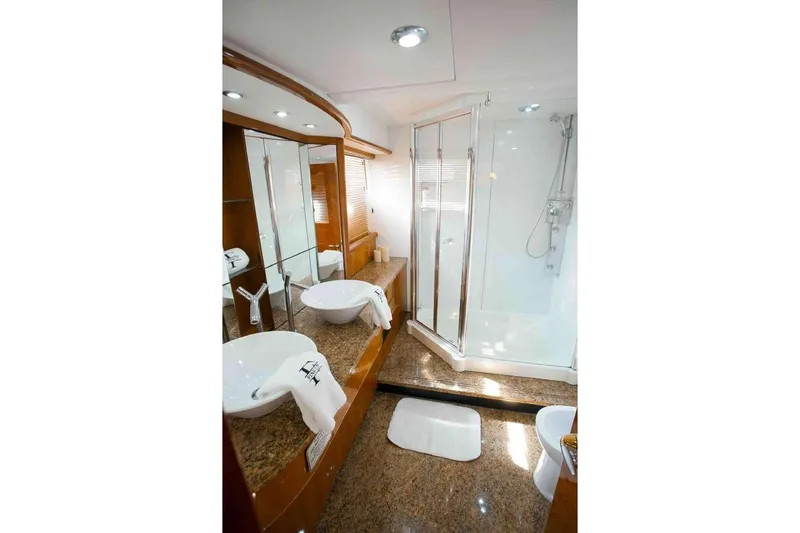 Slide: The Image of Luxurious bathroom in 2006 Sunseeker Manhattan Motor 82 yacht with dual sinks and shower. - 24