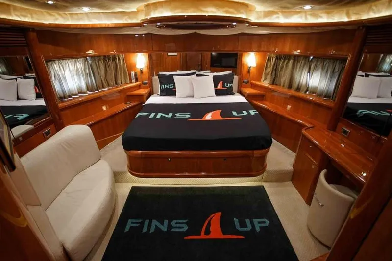 Slide: The Image of Luxurious cabin interior of 2006 Sunseeker Manhattan Motor 82 yacht, featuring elegant wood finishes. - 26