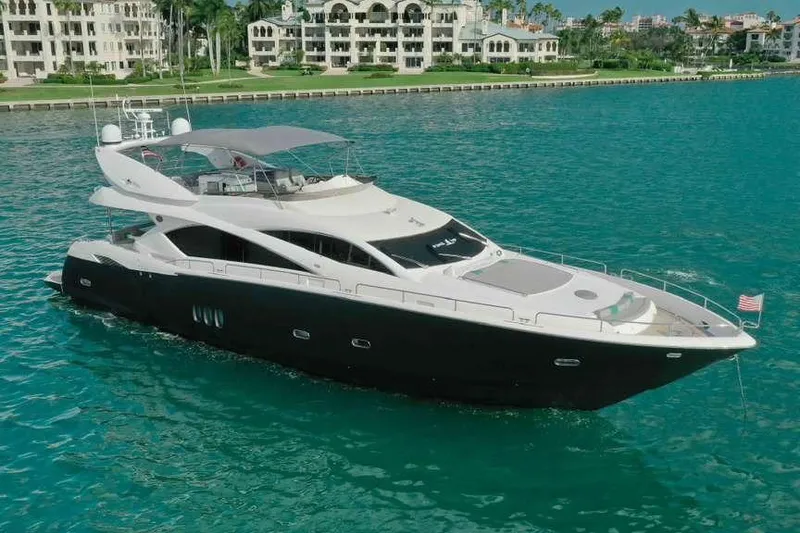 Slide: The Image of Luxury 2006 Sunseeker Manhattan Motor 82 yacht cruising in turquoise waters. - 3