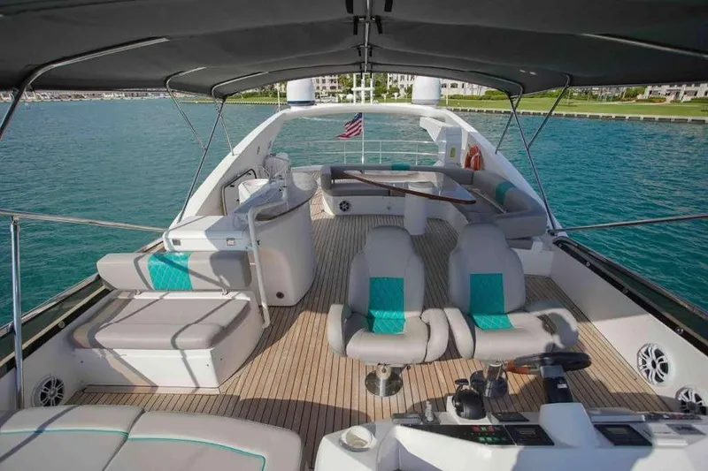 Slide: The Image of Luxurious 2006 Sunseeker Manhattan Motor 82 yacht interior with elegant seating and ocean view. - 32