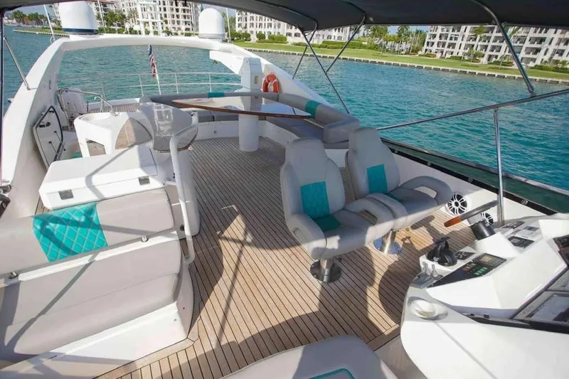Slide: The Image of Luxurious 2006 Sunseeker Manhattan Motor 82 yacht deck with seating and ocean view. - 33