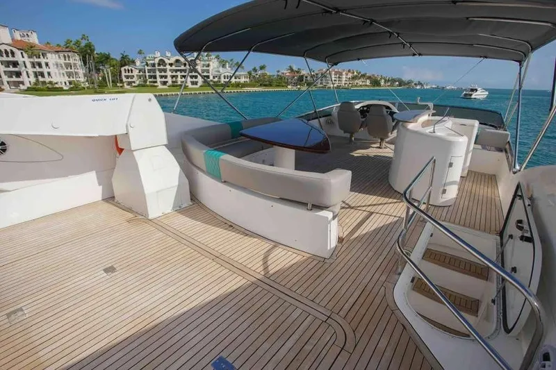 Slide: The Image of Luxurious 2006 Sunseeker Manhattan Motor 82 yacht deck with elegant seating and ocean view. - 34