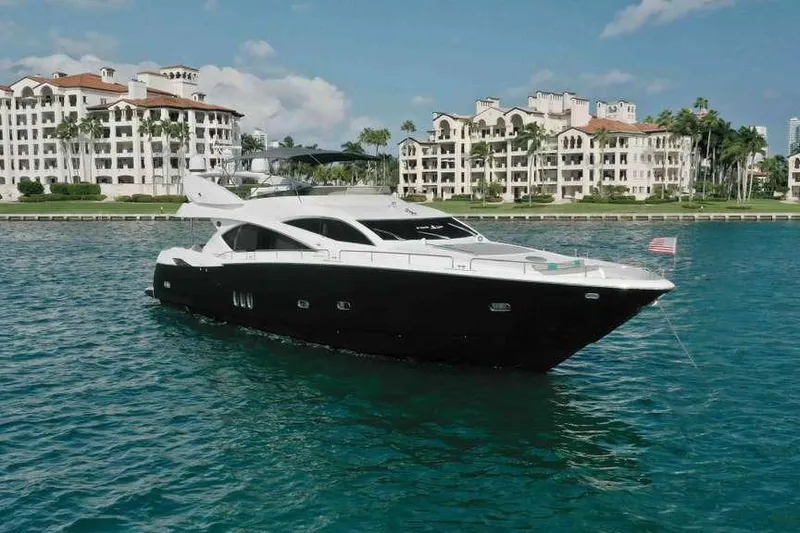 Slide: The Image of 2006 Sunseeker Manhattan Motor 82 yacht on water, luxury waterfront buildings in background. - 4