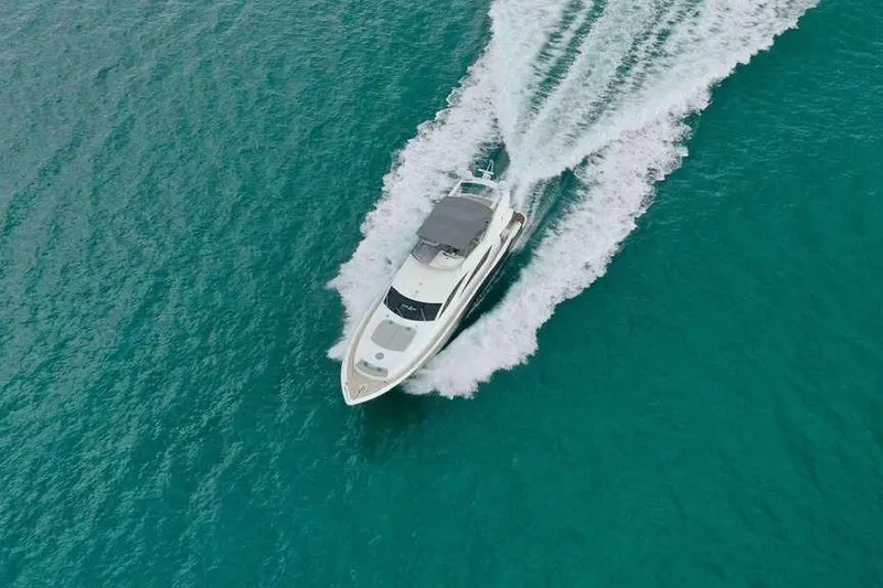 Slide: The Image of Aerial view of 2006 Sunseeker Manhattan Motor 82 yacht cruising in turquoise waters. - 6