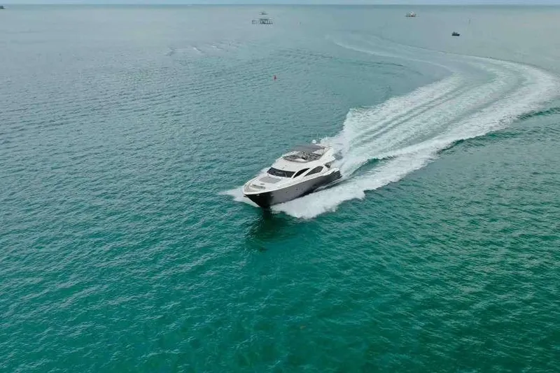 Slide: The Image of 2006 Sunseeker Manhattan Motor 82 yacht cruising on open sea. - 8