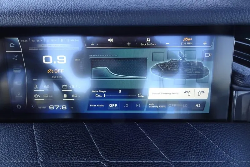 Slide: The Image of 2024 Nautique Super Air Nautique G23 dashboard display with speed, depth, and steering controls. - 22