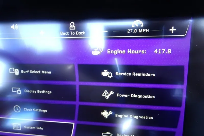 Slide: The Image of 2024 Nautique Super Air Nautique G23 dashboard displaying engine hours and speed. - 23