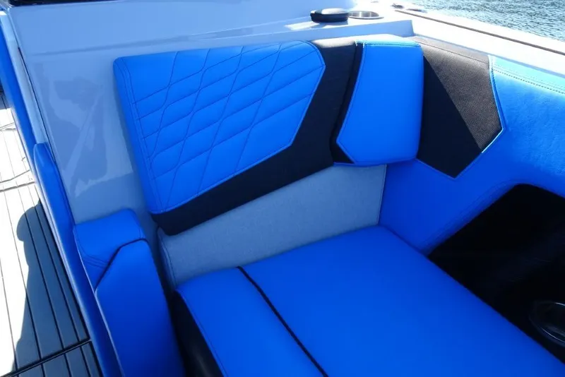 Slide: The Image of 2024 Nautique Super Air Nautique G23 interior with blue and black seating. - 31