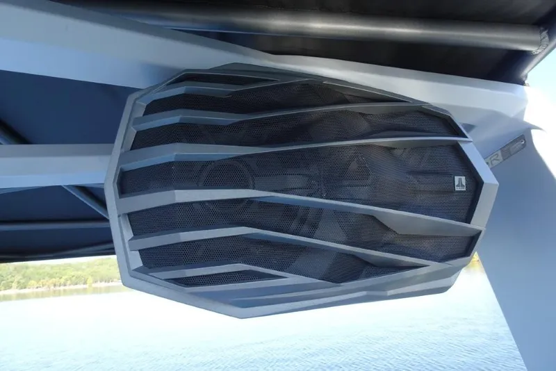 Slide: The Image of 2024 Nautique Super Air Nautique G23 boat speaker, sleek design, mounted under canopy. - 37
