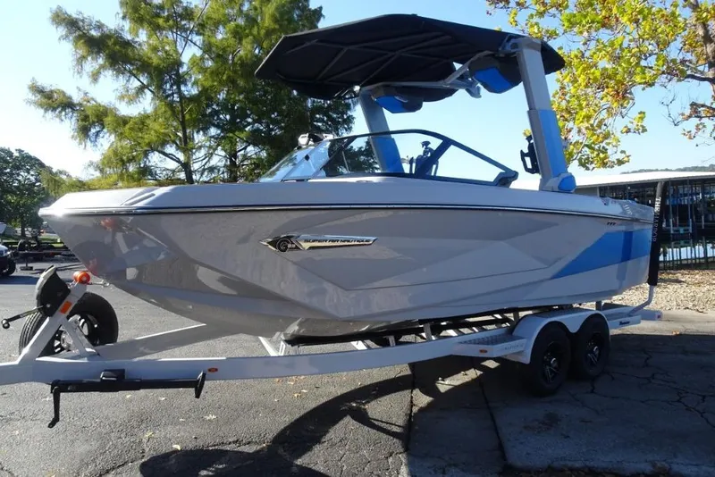 Slide: The Image of 2024 Nautique Super Air Nautique G23 boat on trailer, parked outdoors. - 6
