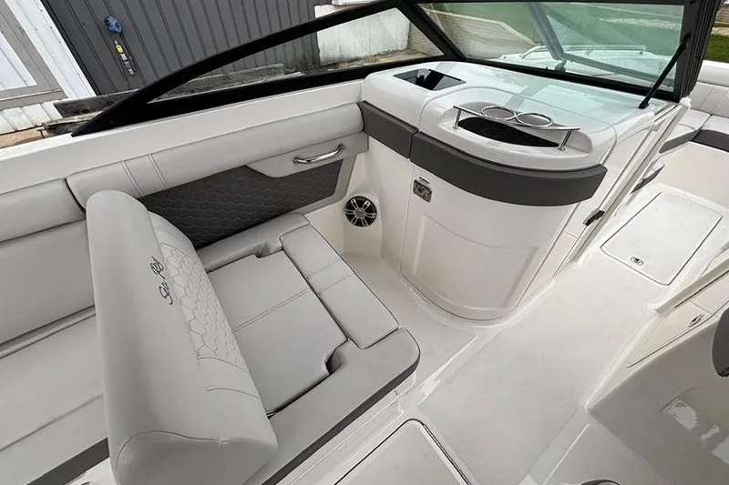 Slide: The Image of 2023 Sea Ray SDX 270 Outboard interior with sleek seating and modern design. - 12