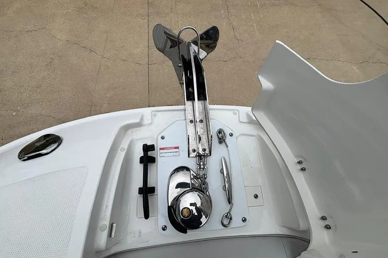 Slide: The Image of 2023 Sea Ray SDX 270 Outboard anchor compartment with stainless steel fittings. - 20