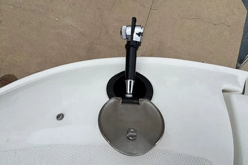 Slide: The Image of 2023 Sea Ray SDX 270 Outboard boat fuel cap and nozzle detail. - 21