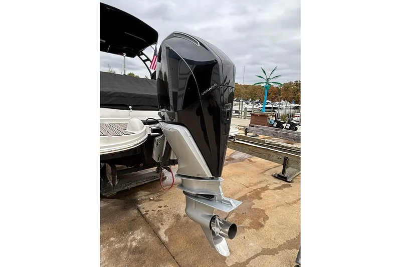 Slide: The Image of 2023 Sea Ray SDX 270 Outboard with powerful Verado engine, docked at marina. - 24