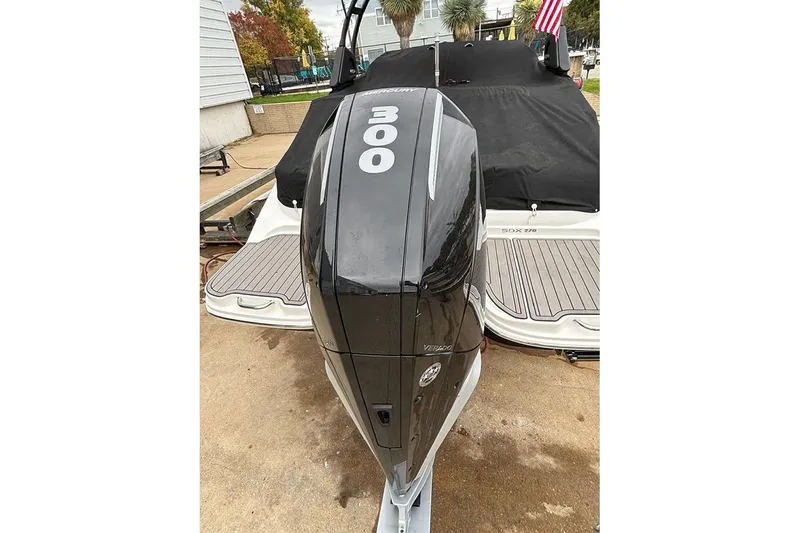 Slide: The Image of 2023 Sea Ray SDX 270 Outboard with powerful 300 HP engine, docked outdoors. - 25
