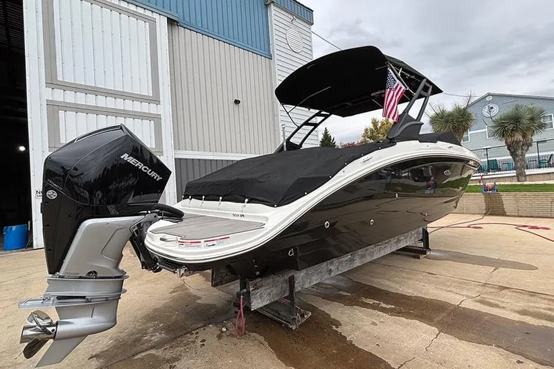 Slide: The Image of 2023 Sea Ray SDX 270 Outboard boat with Mercury engine, docked outdoors. - 5
