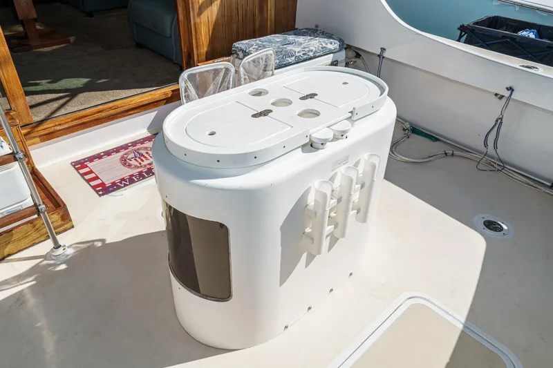 Slide: The Image of 1974 Hatteras Convertible Sportfisher deck with fishing station and rod holders. - 28