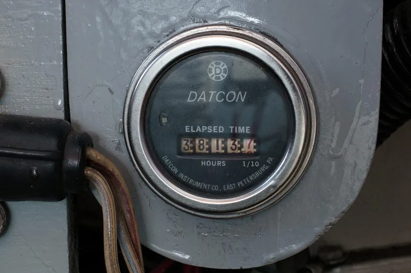 Slide: The Image of Datcon elapsed time meter on 1974 Hatteras Convertible Sportfisher boat dashboard. - 55