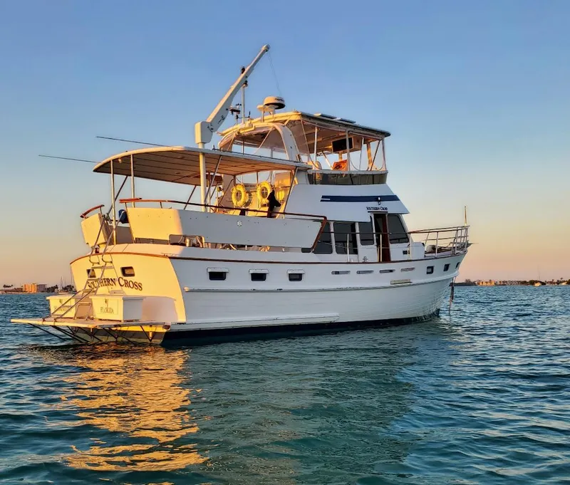 Slide: The Image of 1987 Tayana 45 Expedition Trawler on calm water at sunset. - 3