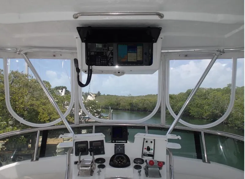 Slide: The Image of Cockpit view of 1987 Tayana 45 Expedition Trawler with navigation equipment and scenic waterway. - 8